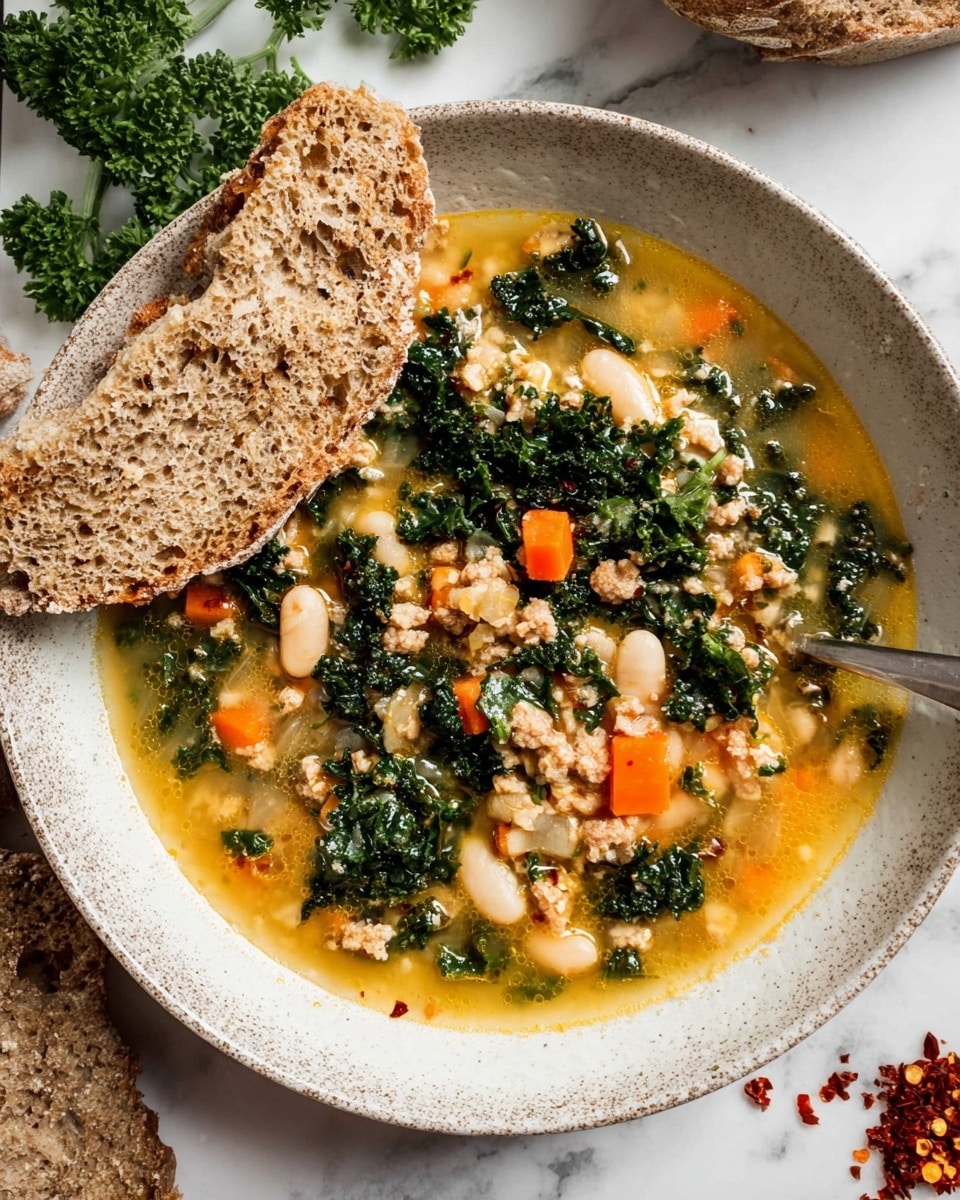 A white pot filled with a chunky soup that has several layers: a light orange broth as the base, mixed with chunks of light beige meat and white beans, scattered with dark green kale leaves, and small bits of orange carrot throughout. In the background on a white marbled surface, there is a bunch of kale, an onion, and a carrot. Photo taken with an iphone --ar 4:5 --v 7