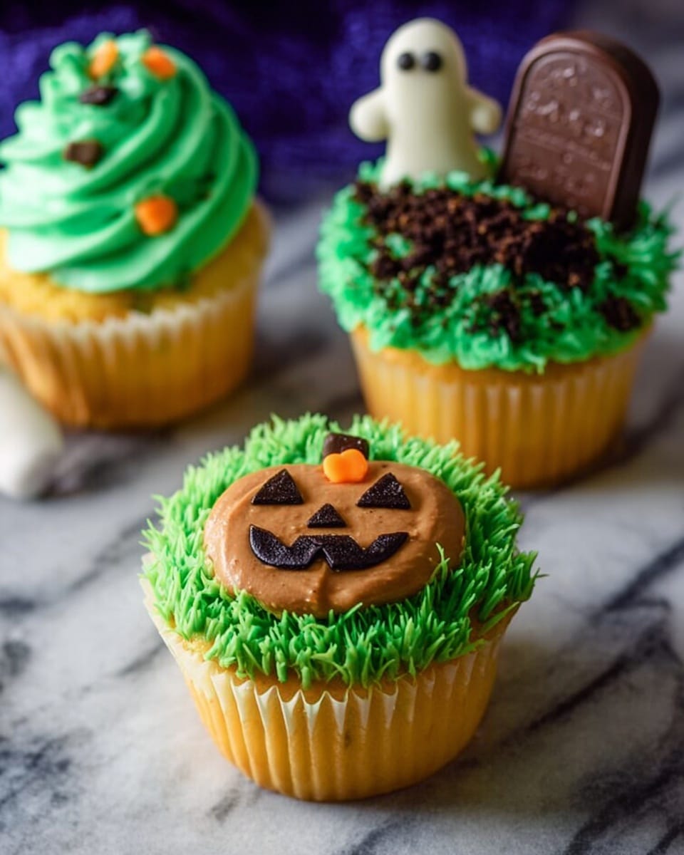 The image shows three yellow cupcakes in white paper liners placed on a white marbled surface. Each cupcake has a bright green frosting layer on top, piped in grass-like strands. The closest cupcake features a layer of smooth brown frosting shaped like a pumpkin with small orange frosting pieces creating a smiling jack-o'-lantern face. The cupcake behind it on the right has green frosting topped with dark brown crumbs and a small rectangular piece of chocolate with a tombstone design. The third cupcake in the background has green frosting with dark crumbs and a white ghost-shaped decoration. The scene is softly lit, highlighting the textures and Halloween theme. Photo taken with an iphone --ar 4:5 --v 7