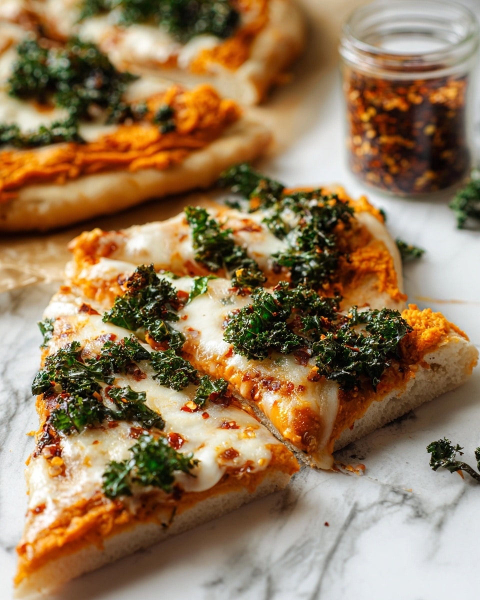 The image shows a close-up of a pizza sliced into four pieces on a white marbled surface with crumpled parchment paper underneath. The pizza has one thick crust layer that is golden-brown and slightly textured. On top of the crust is an orange-red tomato sauce layer, spread evenly. Above the sauce, there is a melted white cheese layer with a few browned spots. Dark green, crispy kale leaves are scattered unevenly on the cheese surface. There is a small glass jar of red chili flakes in the upper right corner and fresh kale leaves placed at the bottom right. Photo taken with an iphone --ar 4:5 --v 7