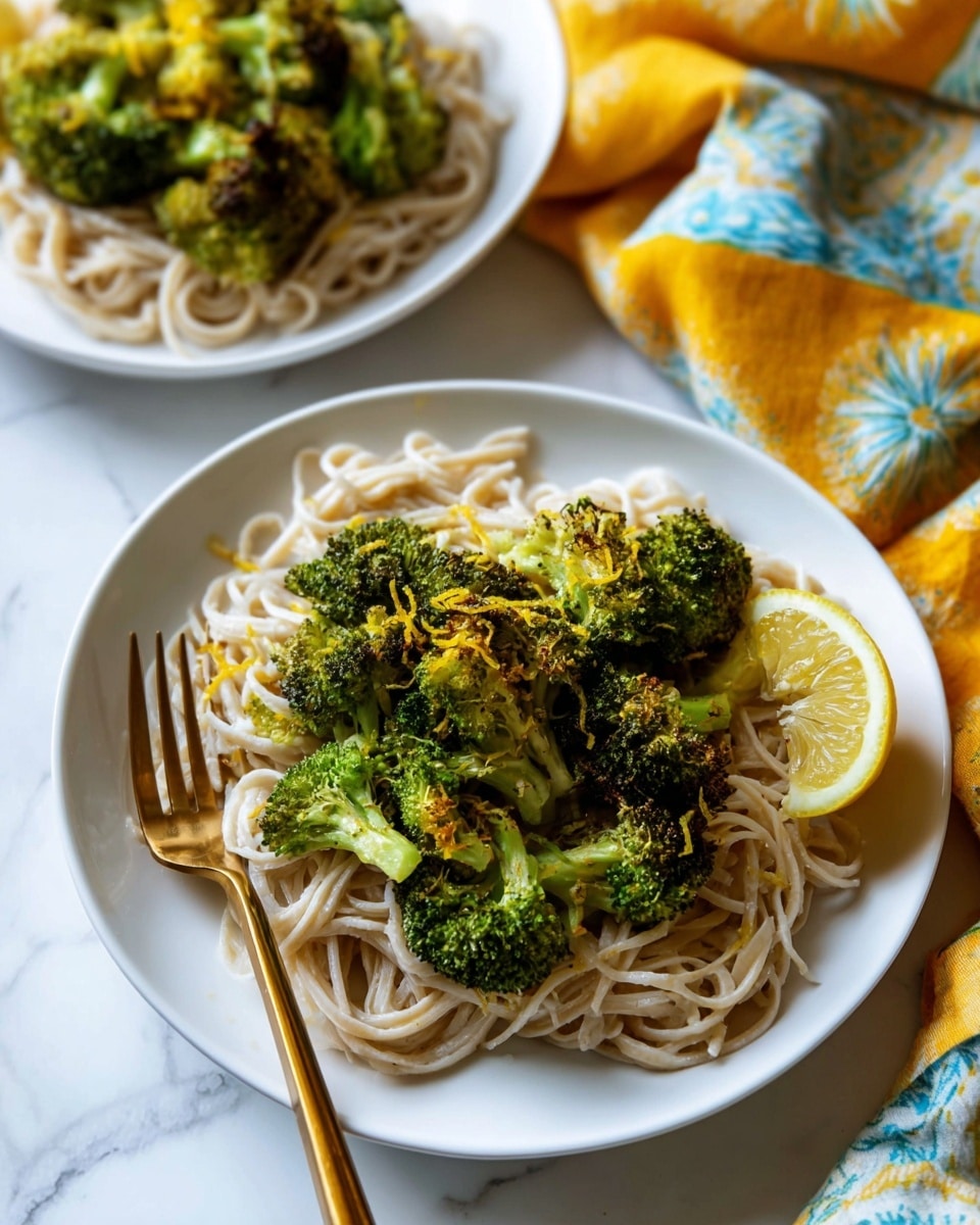 A white bowl filled with light brown noodles forming the base layer, topped with a thick green broccoli and chicken curry sauce that covers most of the noodles. The green sauce has a slightly chunky texture with visible broccoli pieces and tender chicken chunks. A lemon slice is placed on the bowl's edge. A woman's hand holding a fork is resting in the bowl. The bowl sits on a white marbled surface with a yellow and orange cloth to the side. Photo taken with an iphone --ar 4:5 --v 7