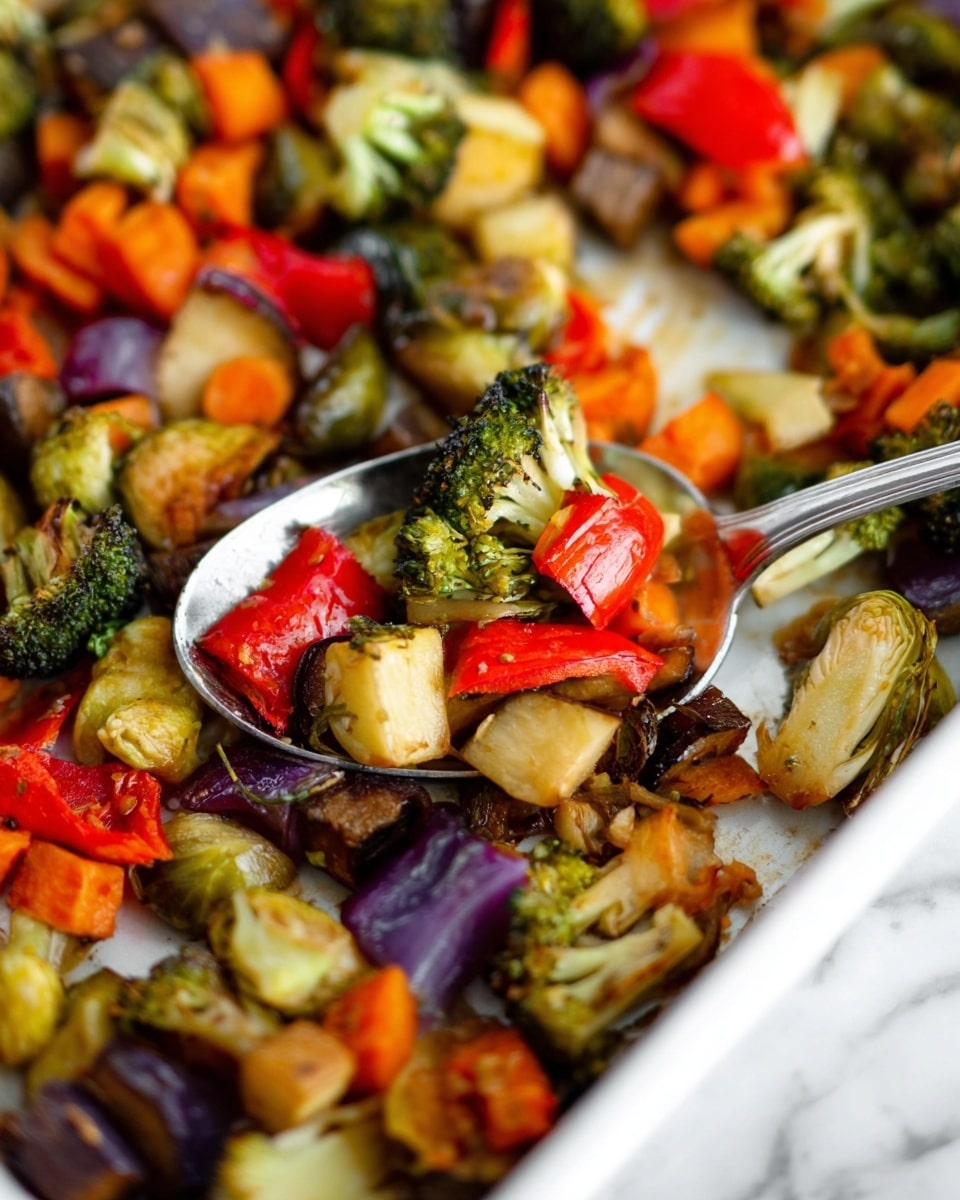 The image shows a close-up of a tray filled with roasted mixed vegetables. The vegetables include green broccoli florets, orange carrot pieces, red bell pepper chunks, purple eggplant cubes, and light yellow brussels sprout halves. The colors are bright with a slightly shiny, cooked texture. A spoon scoops some of the vegetables from the white tray, highlighting the mix of colors and textures. The background surface is a white marbled texture. photo taken with an iphone --ar 4:5 --v 7