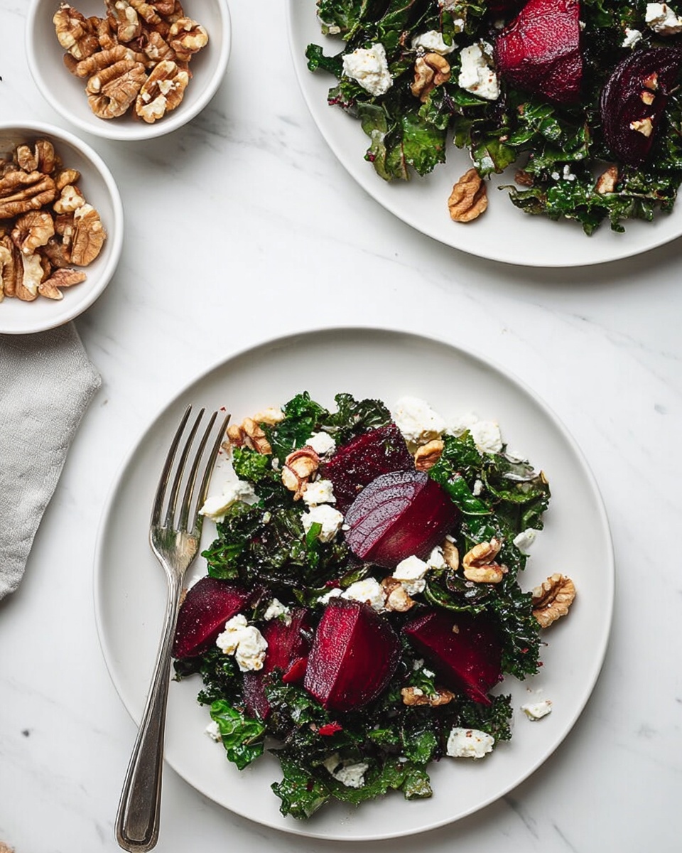The image shows a white plate with a salad made of three main layers: the bottom layer has dark green, crinkled kale leaves spread evenly; the middle layer has deep red beet slices, thick and glossy, placed on top of the kale; the top layer has small chunks of white cheese, slightly crumbly, and light brown walnut pieces scattered across the salad. A metal fork leans on the left side of the plate. The plate is set on a white marbled surface. Above the plate, there is another partial view of the same salad on a white plate and two small bowls, one filled with walnut halves and the other with white cheese chunks. photo taken with an iphone --ar 4:5 --v 7