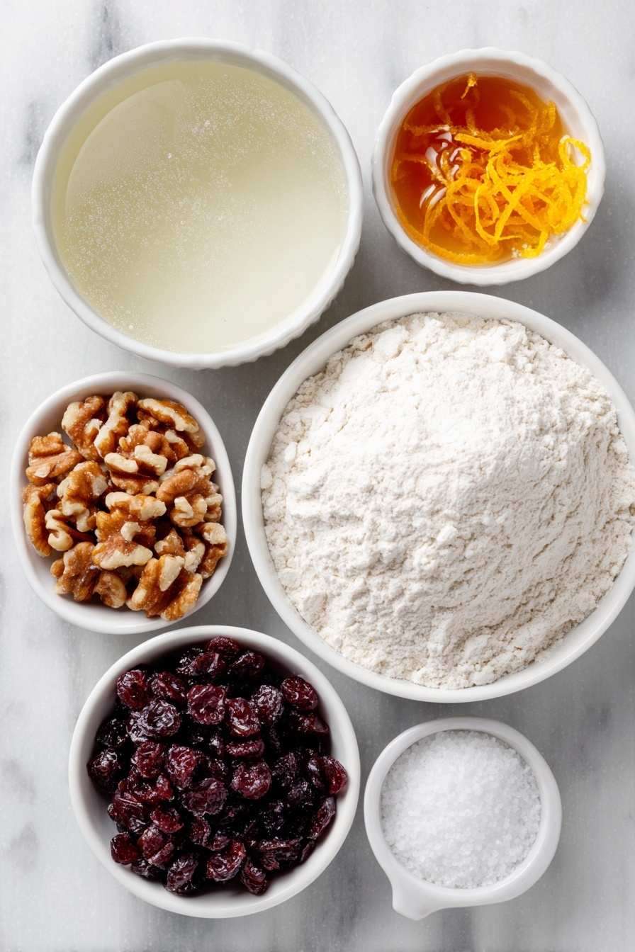 Flat lay of a small mound of fine white bread flour, a small white ceramic bowl of warm water shimmering gently, a small white ceramic bowl with golden honey, a few rough chunks of dried cranberries, roughly chopped pieces of fresh walnuts, a small white ceramic bowl of granulated sugar, a small white ceramic bowl of coarse kosher salt, bright fresh orange zest curls, a small mound of active dry yeast granules, all arranged in perfect symmetry on a clean white marble surface, soft natural light, photo taken with an iPhone, professional food photography style, fresh ingredients, white ceramic bowls, no bottles, no duplicates, no utensils, no packaging --ar 2:3 --v 7 --p m7354615311229779997 - No-Knead Cranberry Walnut Bread, easy holiday bread, festive cranberry walnut loaf, no knead bread recipe, cranberry walnut bread instructions