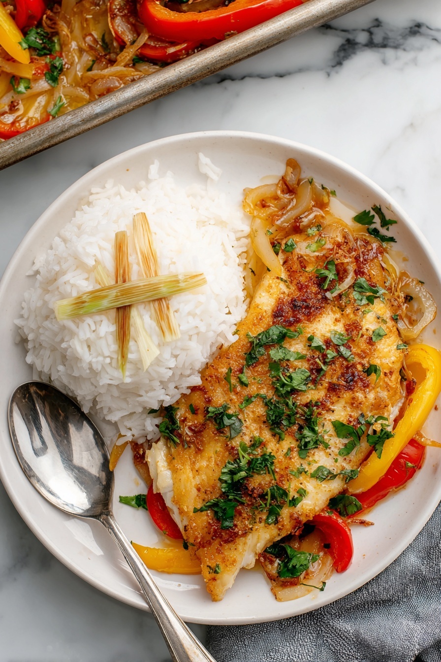 The image shows a metal baking tray filled with four golden-brown cooked fish fillets, laying on a bed of cooked onions and red and yellow bell pepper strips. The fillets have a crispy and seasoned texture with some visible black pepper and spices. Around the fish and vegetables, there are three lemon wedges placed on top and around the edges. The onions are soft and slightly caramelized, mixed with the colorful pepper slices soaked in sauce. The background is a white marbled texture. photo taken with an iphone --ar 2:3 --v 7 - Lemon Garlic Baked Tilapia, healthy baked fish dinner, easy seafood recipe, quick fish recipes, flavorful lemon garlic tilapia